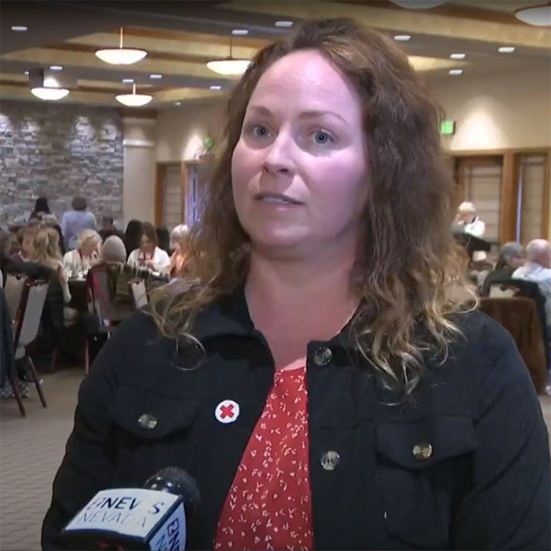 Northern Nevada Executive Director Bridget Posson speaking to news reporter at a Red Cross event.