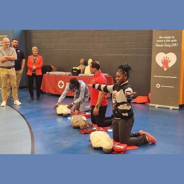 Volunteers from the audience participate in an AED demonstration