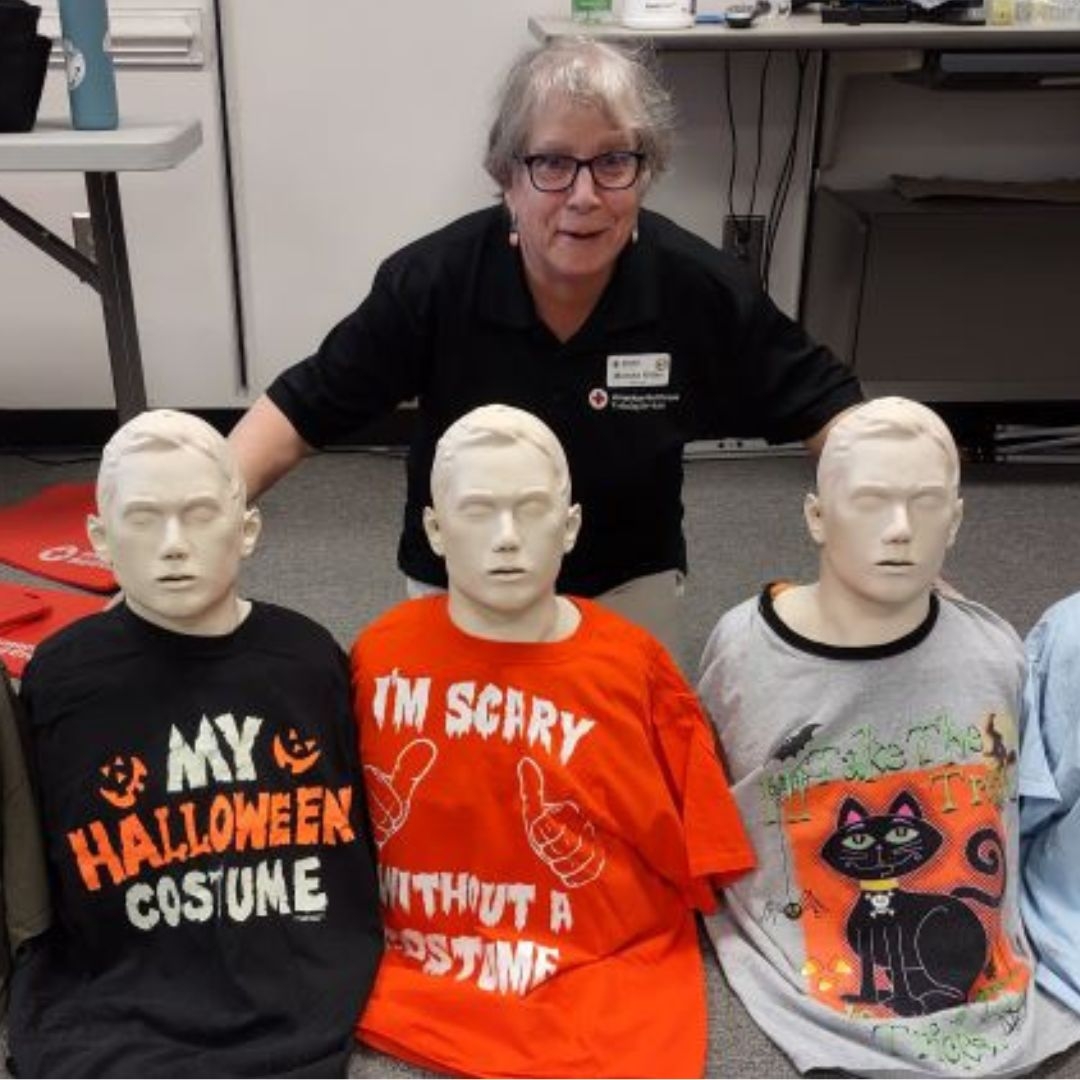 marsh kitter standing with mannequins in halloween attire