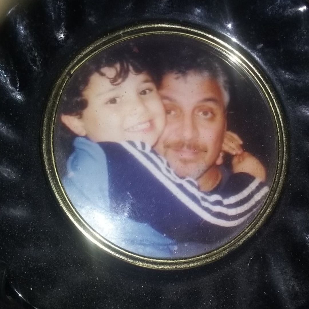 photo pin of Daniel Agnelli hugging his dad Stephen when he was a child.