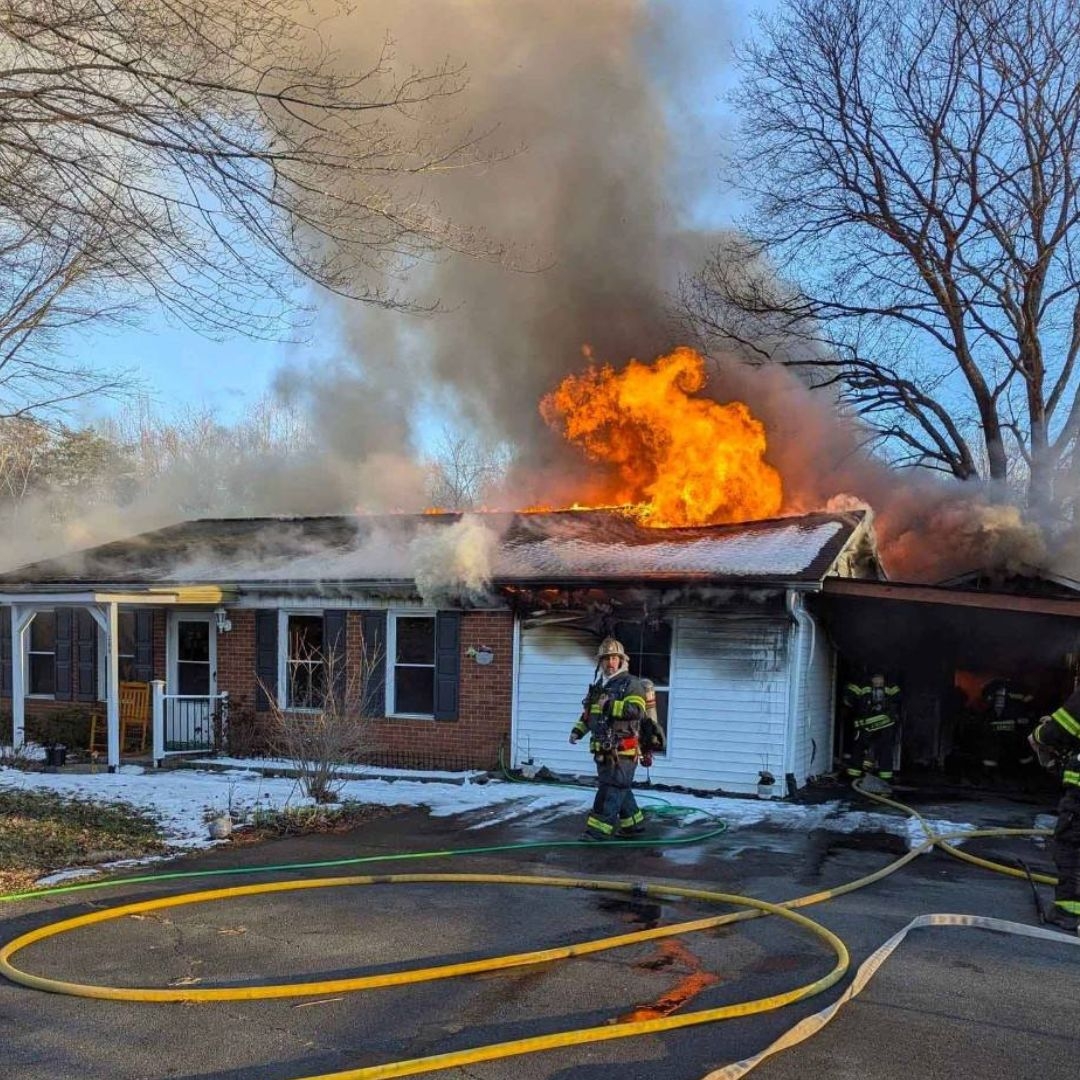 fireman putting out house fire