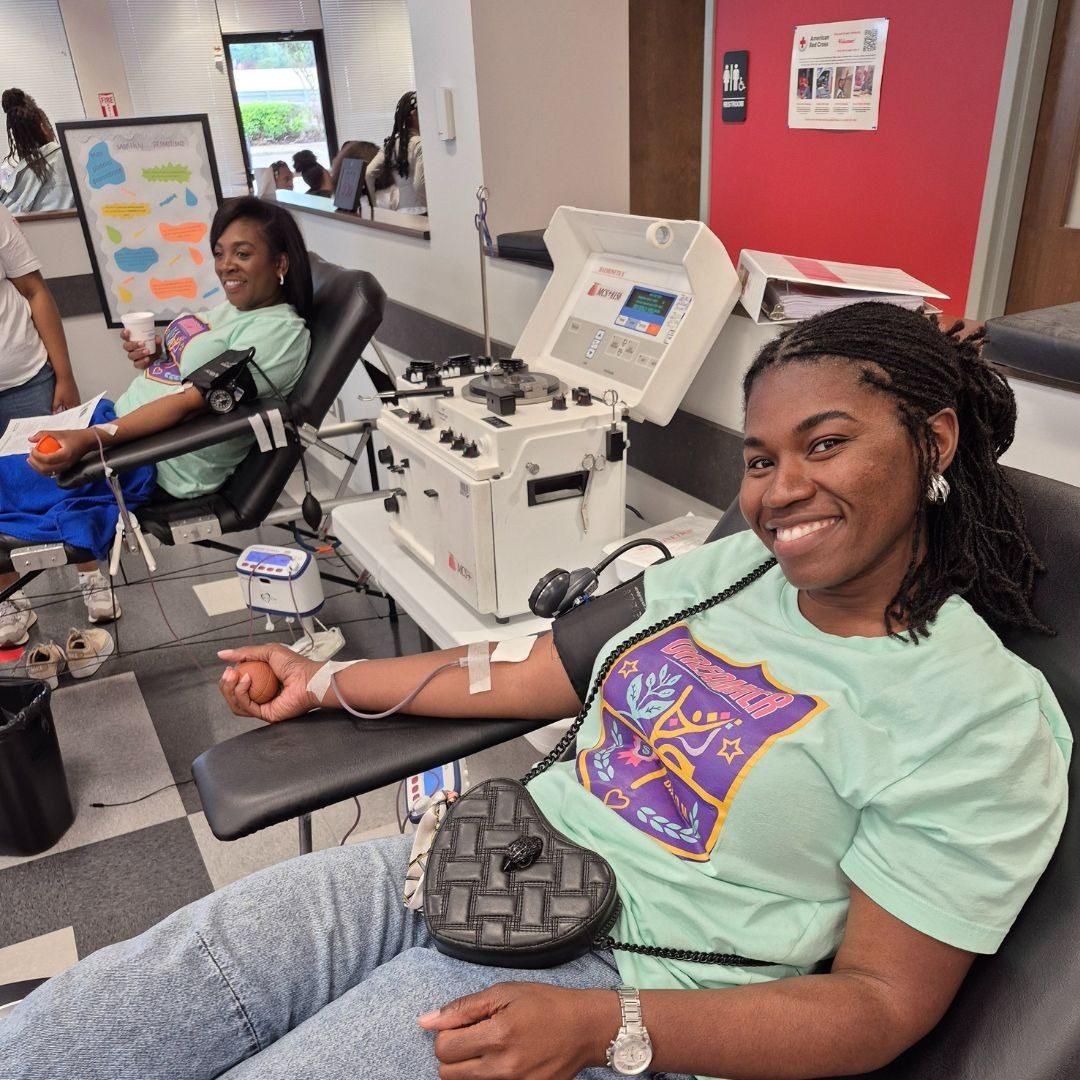 two women donating blood