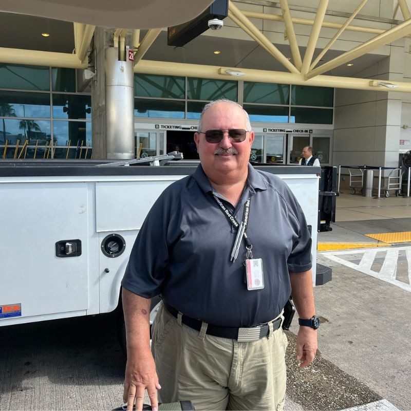 Mike Green standing in front of airport.