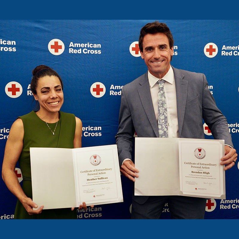 Heather Sullivan and Brendan Bligh hold up their Red Cross award certificates they received.