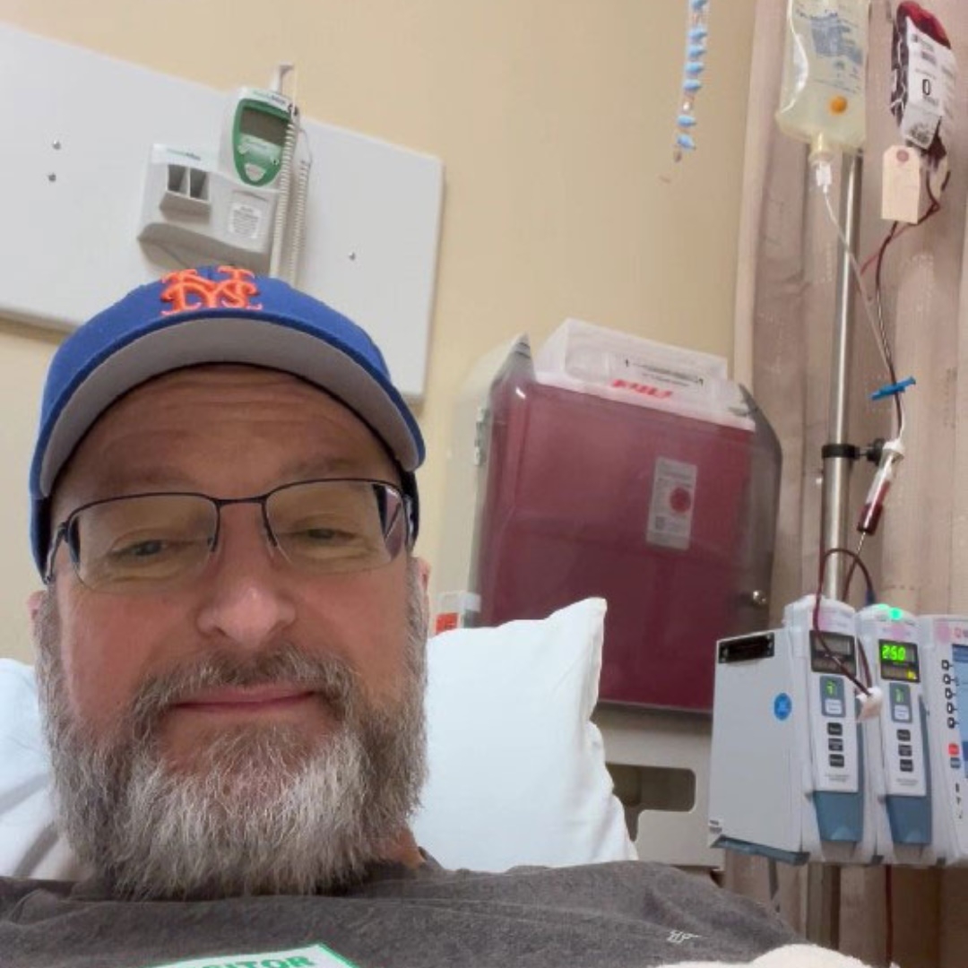 Person in hat in a hospital bed.