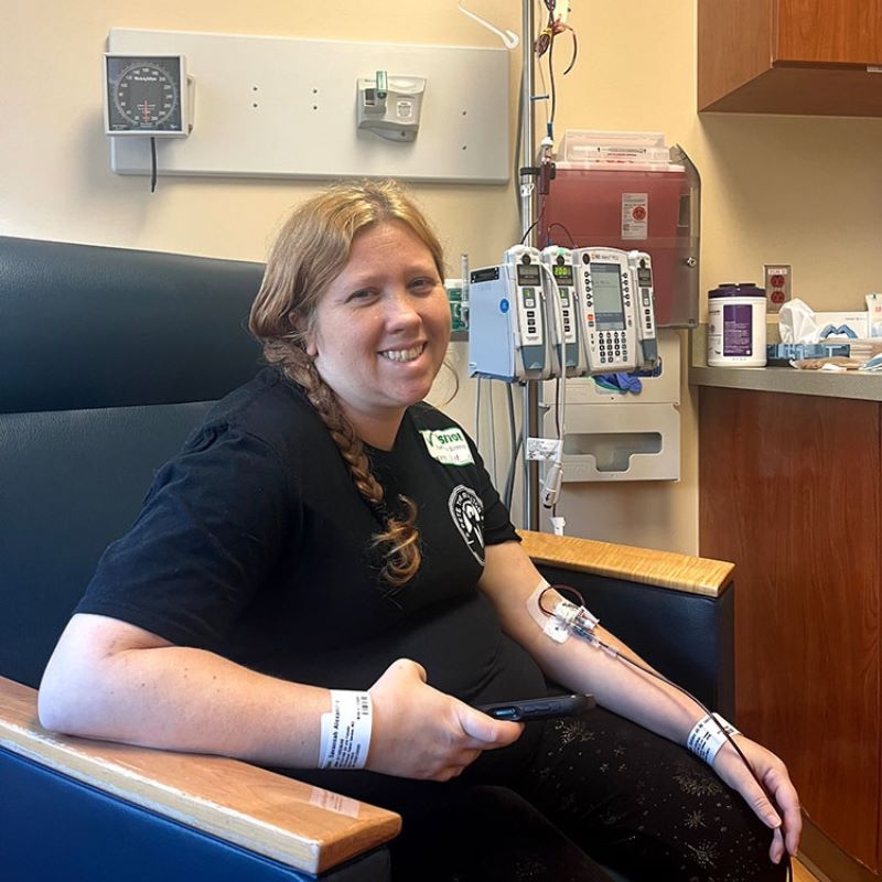 Savannah getting a blood transfusion smiling.