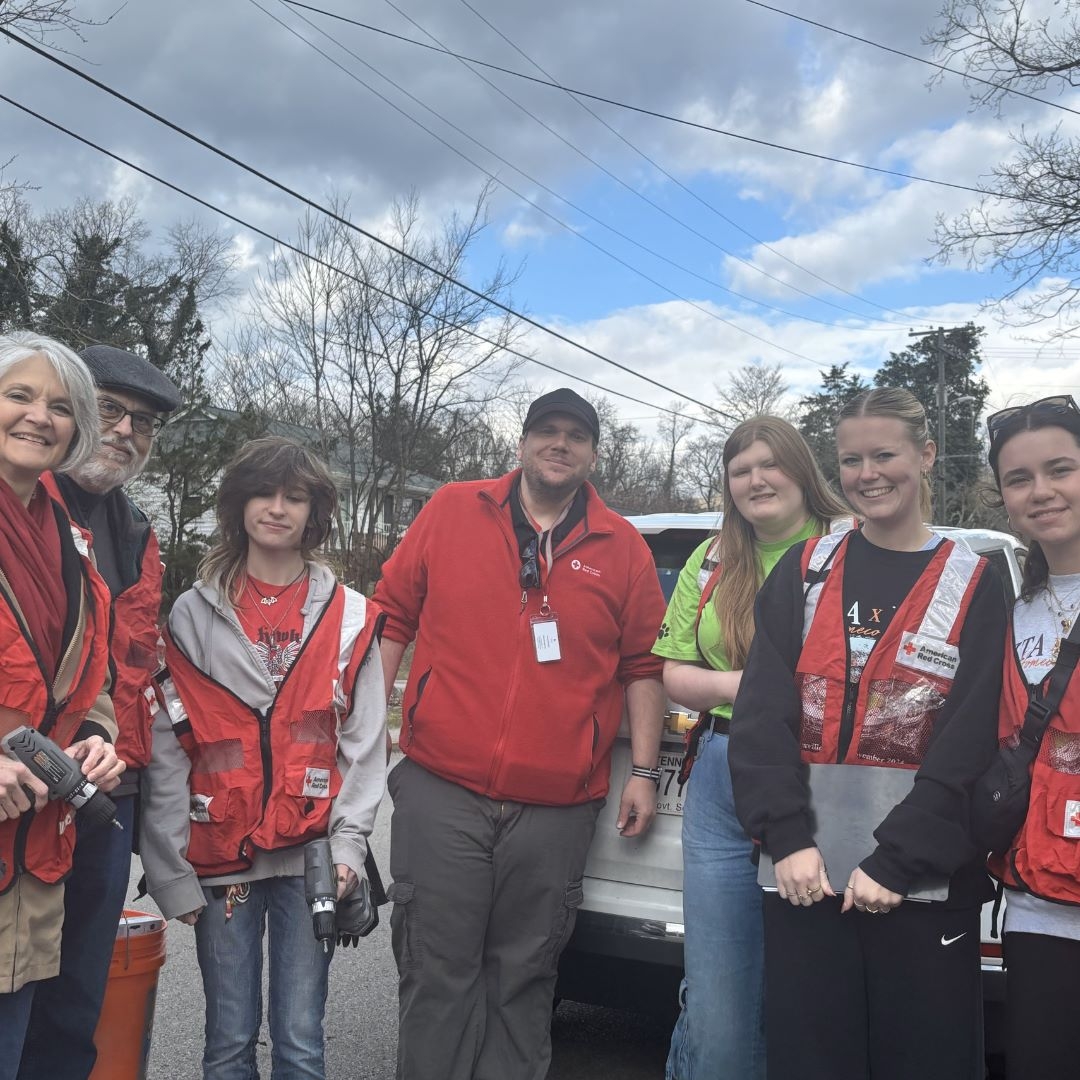 Group of red cross volunteer posing for a group picture.
