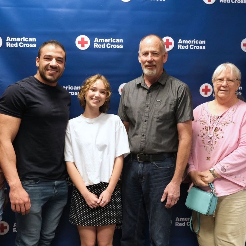 Kate posing for a group picture with donors.