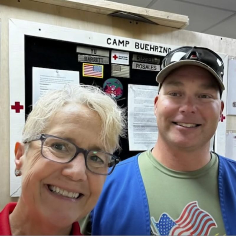 Heidi smiling with another volunteer.