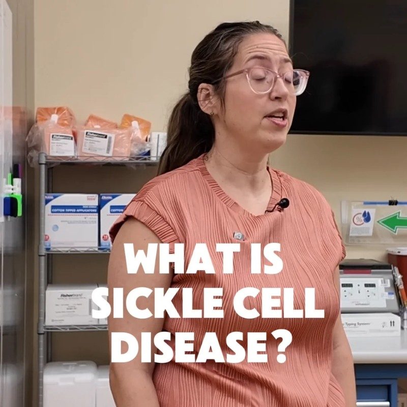 Dr. Courtney  speaking to a room of students with "What is sickle cell disease" text.