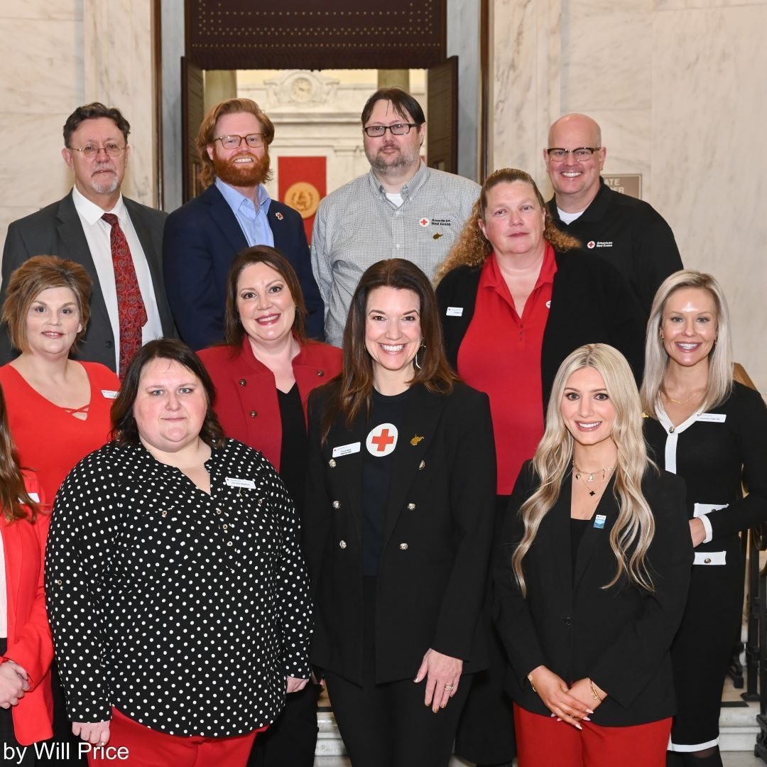 group of people wearing red and black