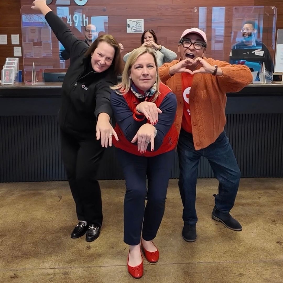 three people holding a dance pose