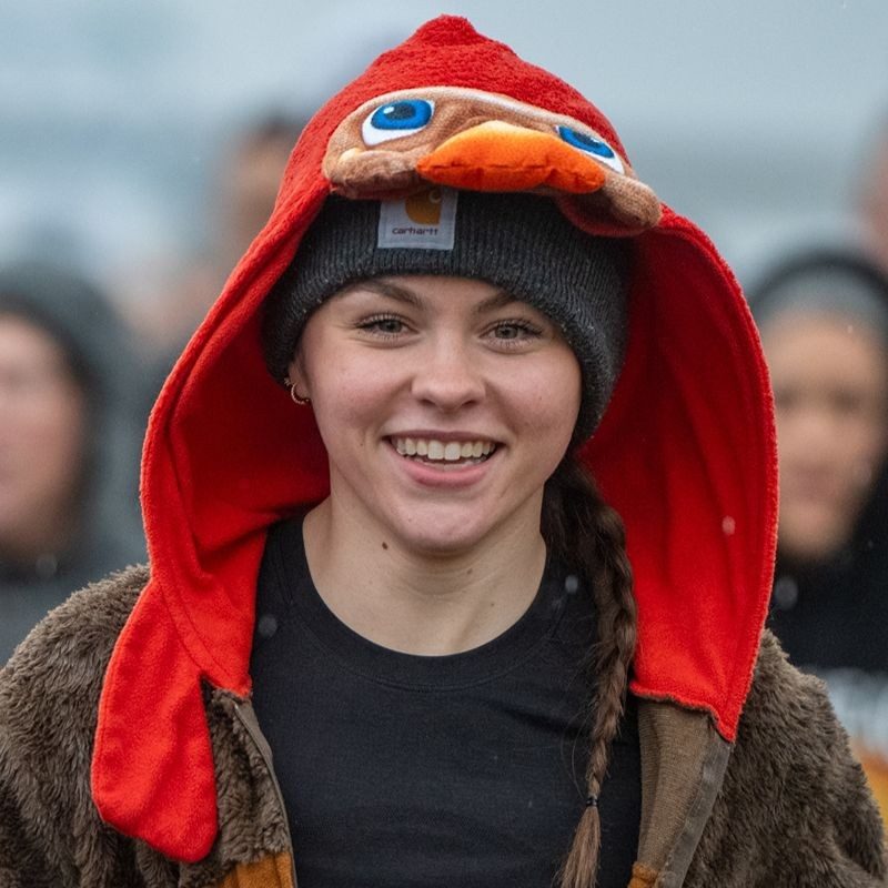 A Turkey Trot runner smiling during the run.
