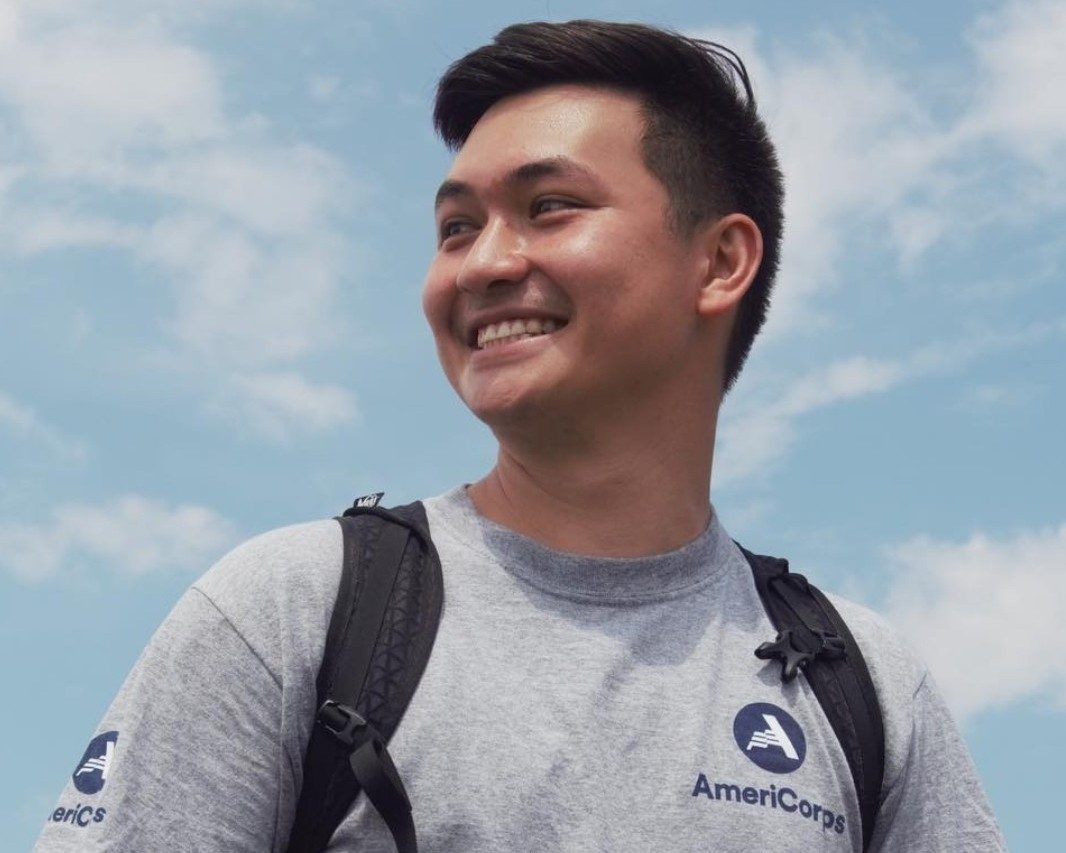 Ared cross volunteer smiling with backpack