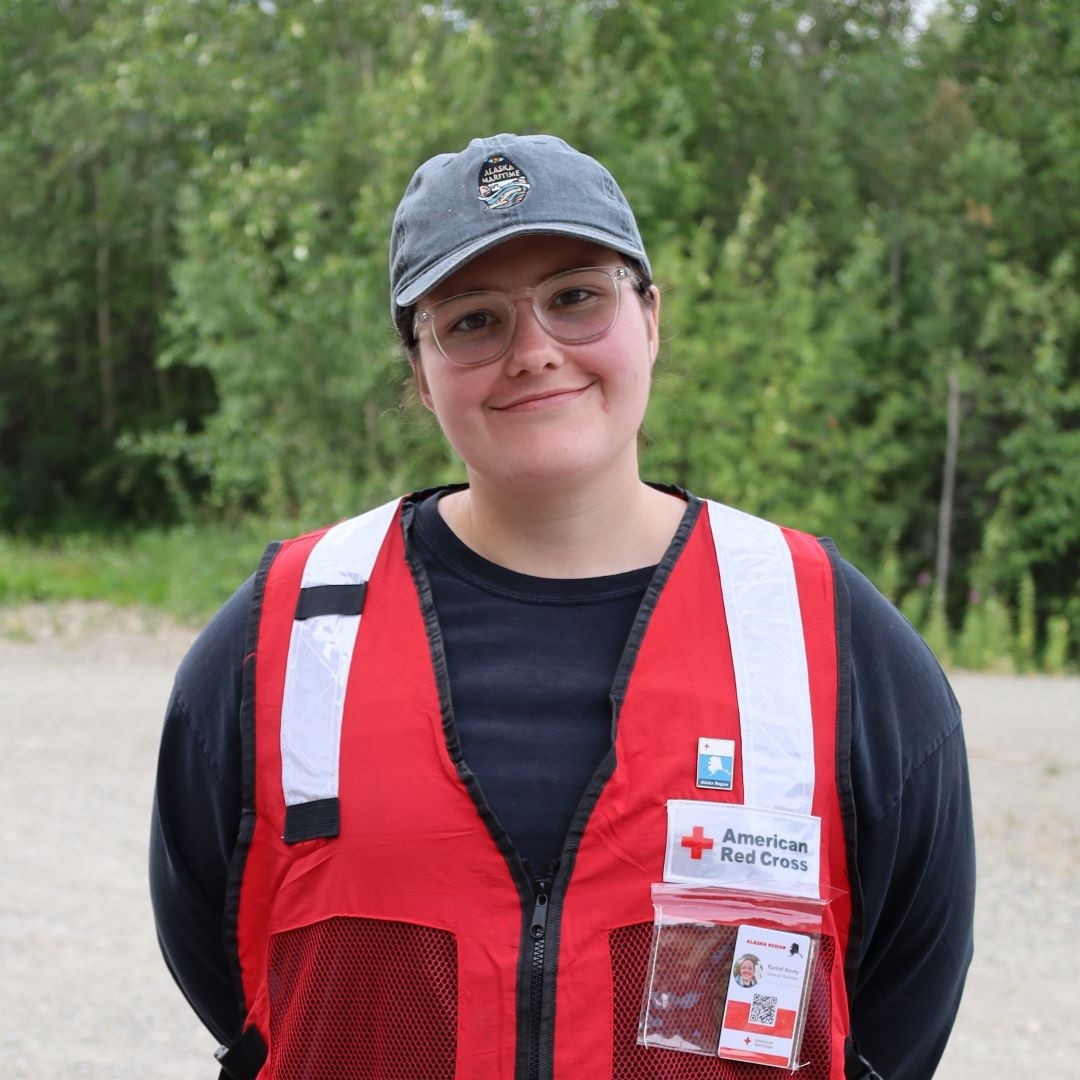 woman in red cross vest
