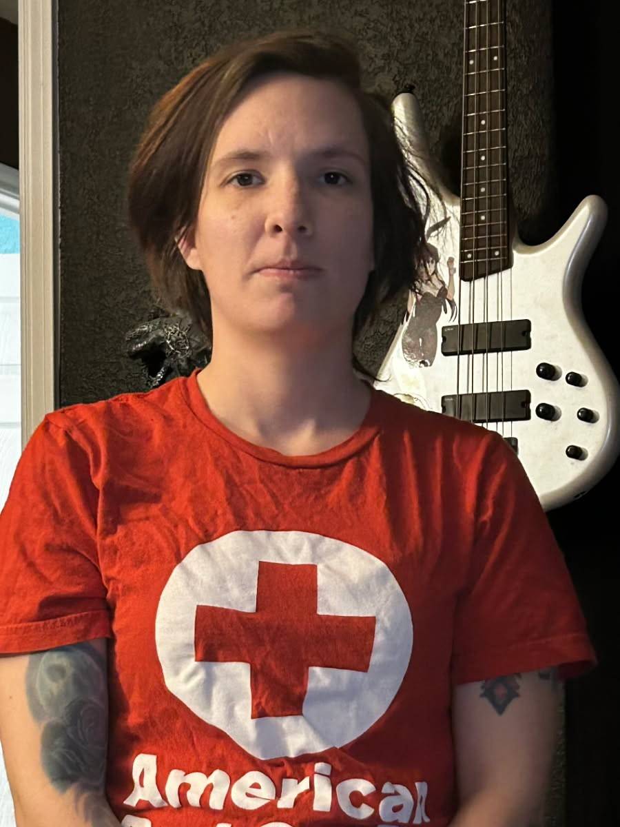 Woman in Red Cross shirt
