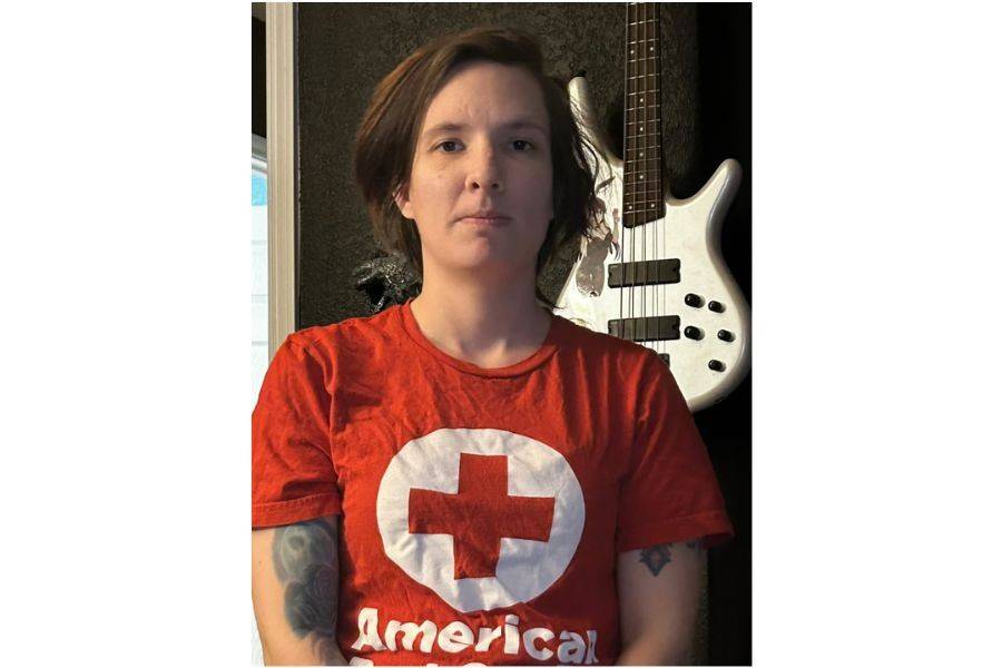 Woman in Red Cross shirt