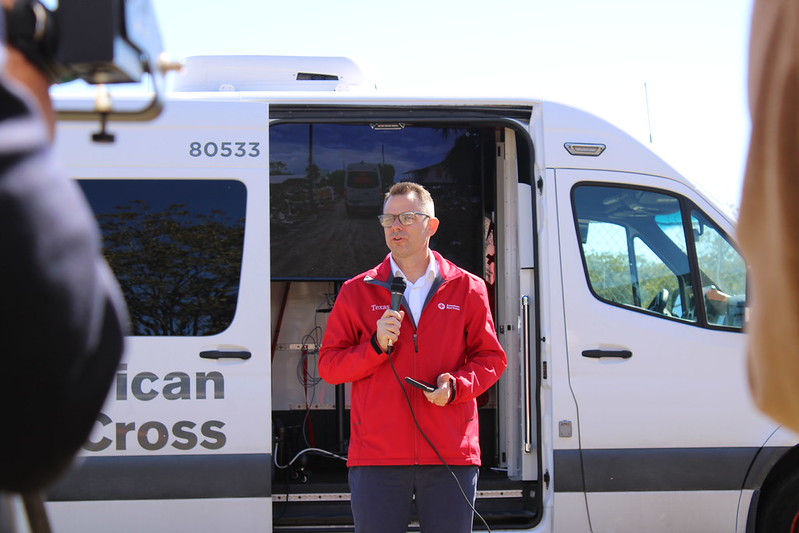 red crosser speaking at ground breaking event