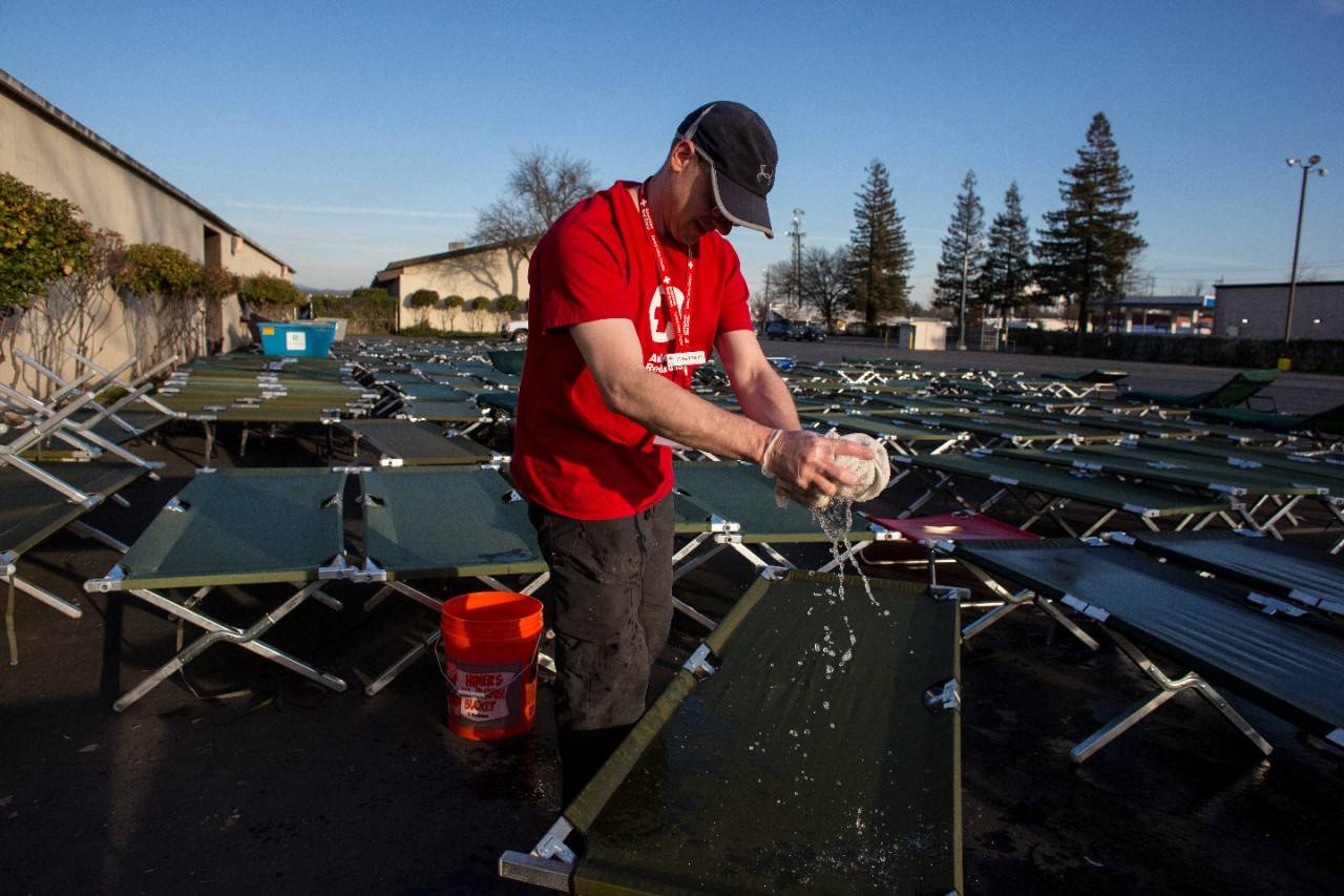February 14, 2017. Chico, California.
Red Cross volunteer JR Matchett cleans cots outside of the Red Cross Silver Dollar Fairgrounds shelter in Chico, California. JR has been a volunteer with the Red Cross for three years and lives locally in the Yosemite, California area. JR most recently deployed to the Louisiana Flooding operation in August 2016, where he also held a sheltering position.
Photo by Marko Kokic for the American Red Cross