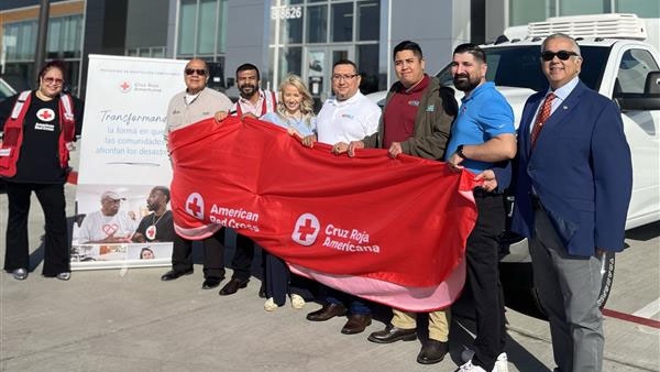 Red Cross and Bert Ogden employees next to donated brand-new RAM 2500 4X4 All-Wheel Drive delivery vehicle.