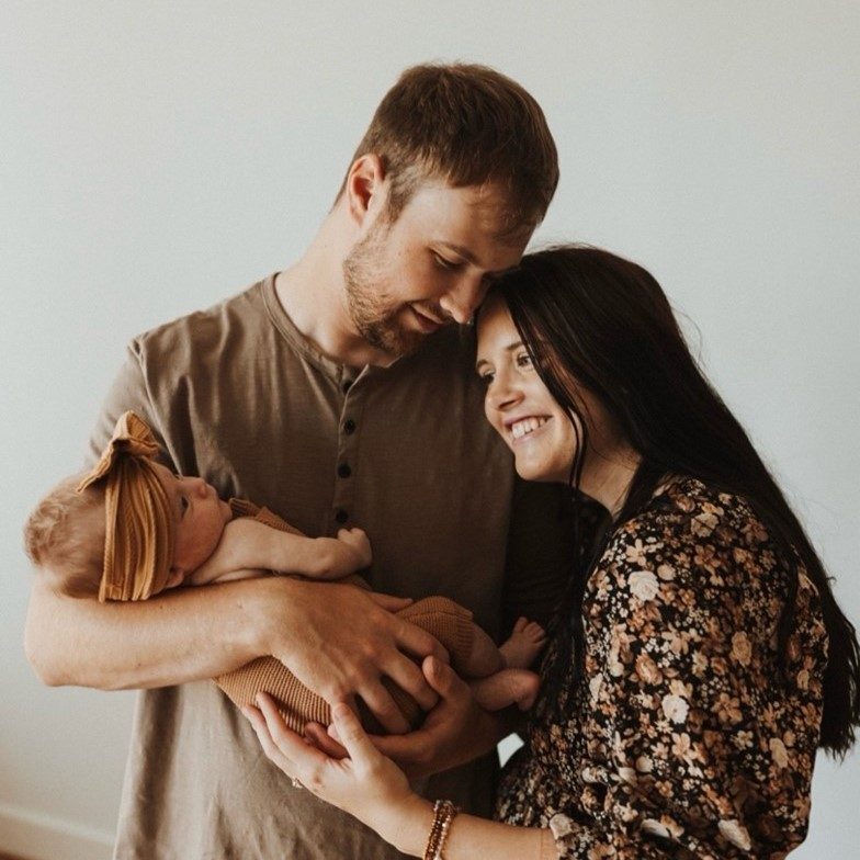 couple holding newborn baby
