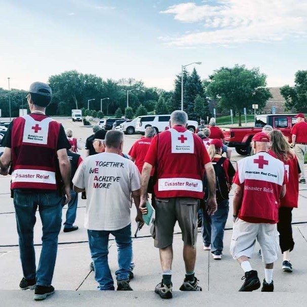 group of red cross volunteers walk away