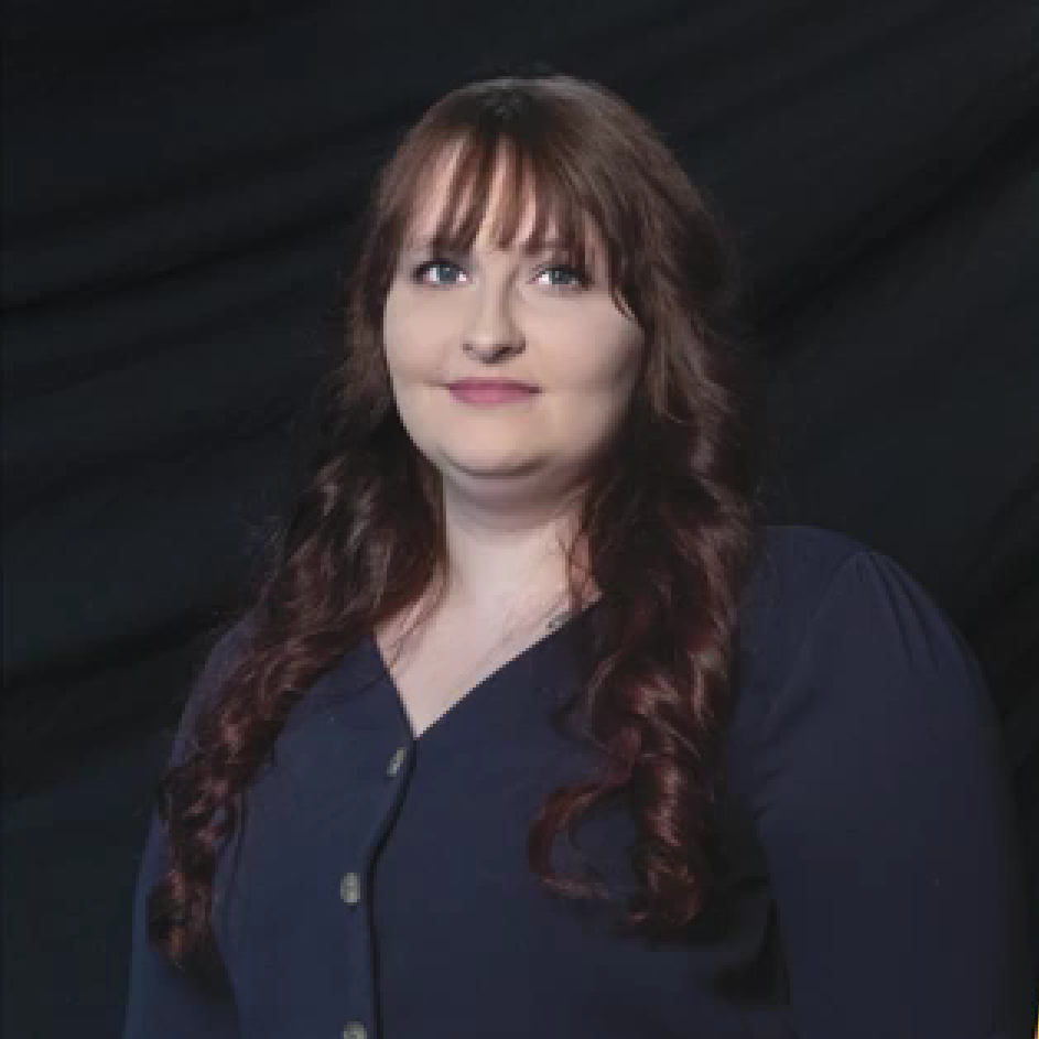headshot of woman in blue shirt