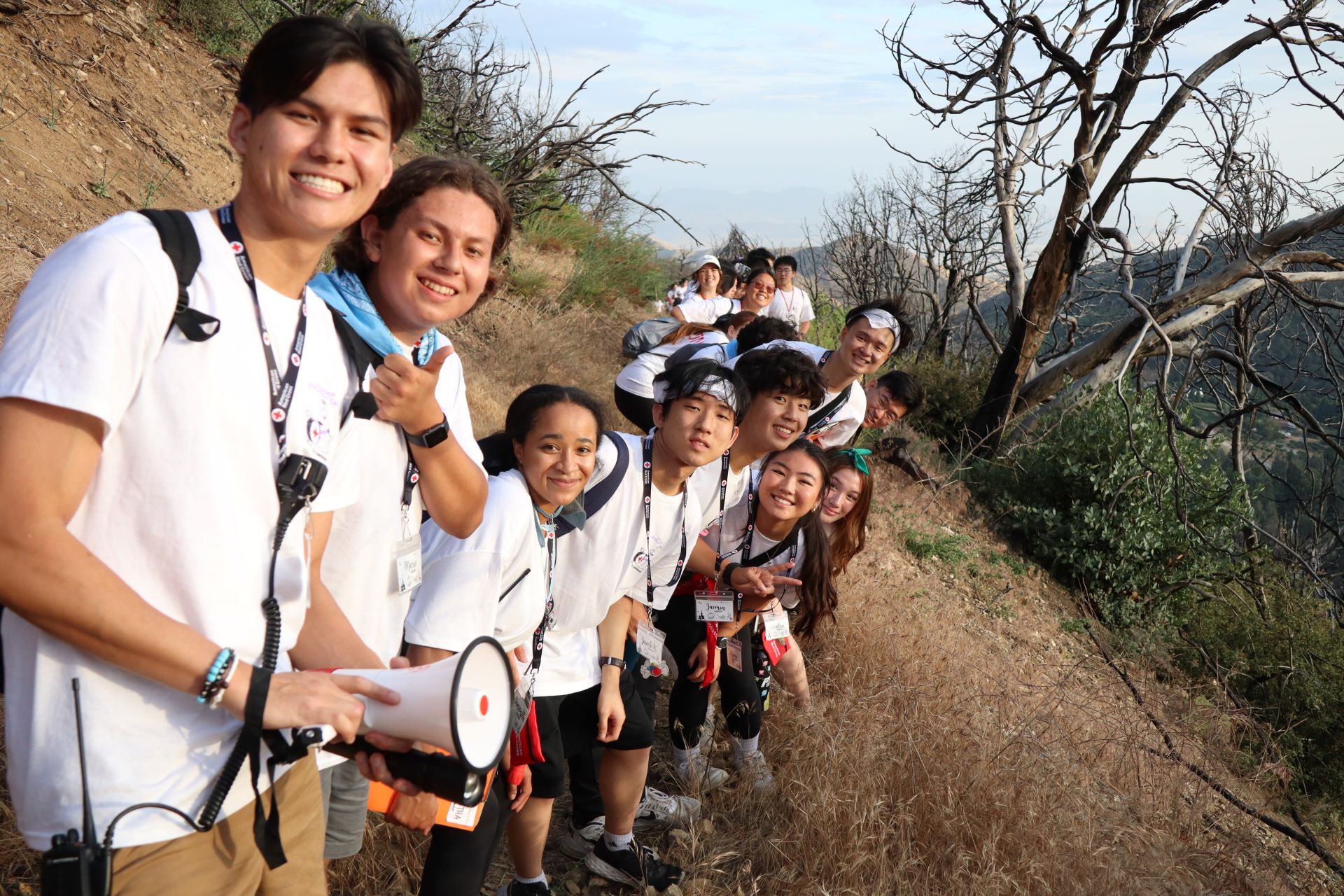 group of campers hiking in the woods