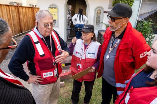 man and woman volunteer viewing papers