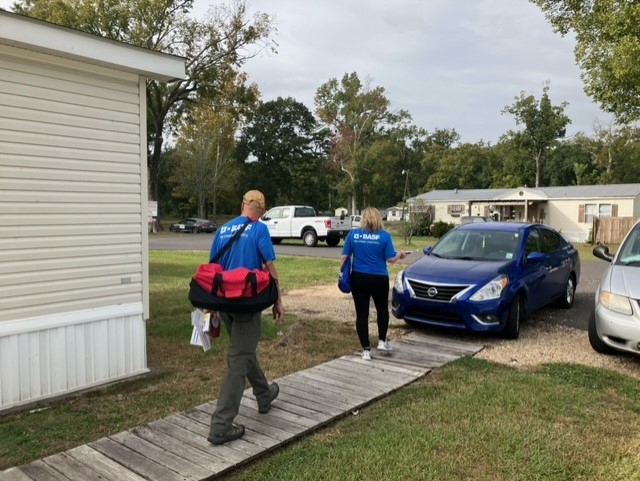 two red cross volunteers walking 