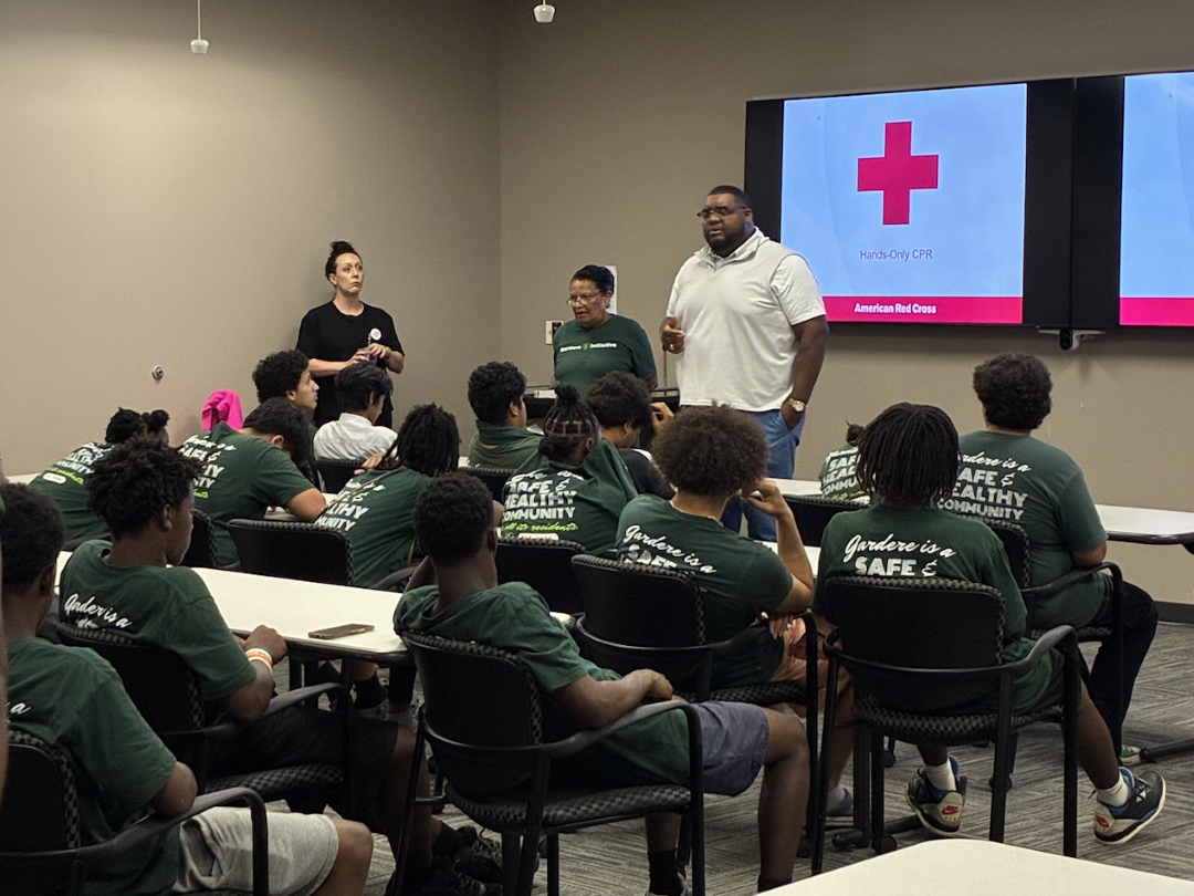 Youth listen to presentation in room