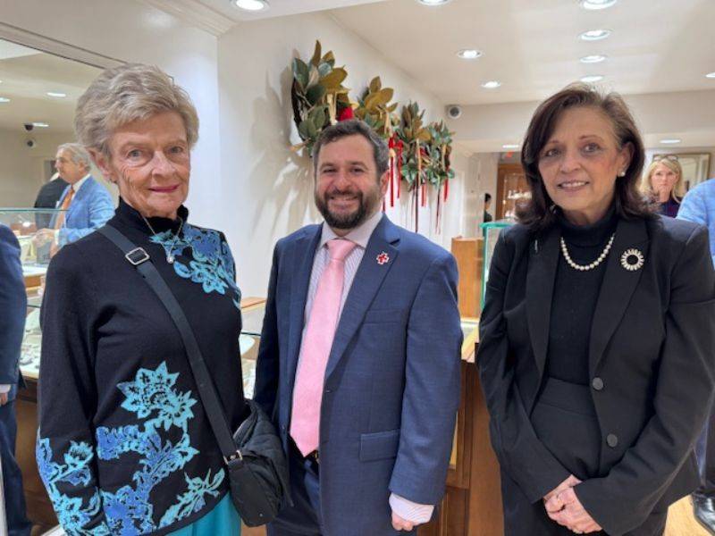 Three people standing next to each other