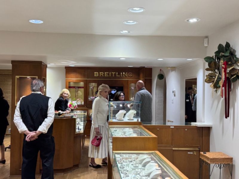 Group of people shopping in a jewlery store.