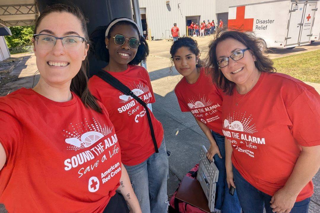 Group of women in sound the alarm shirts 