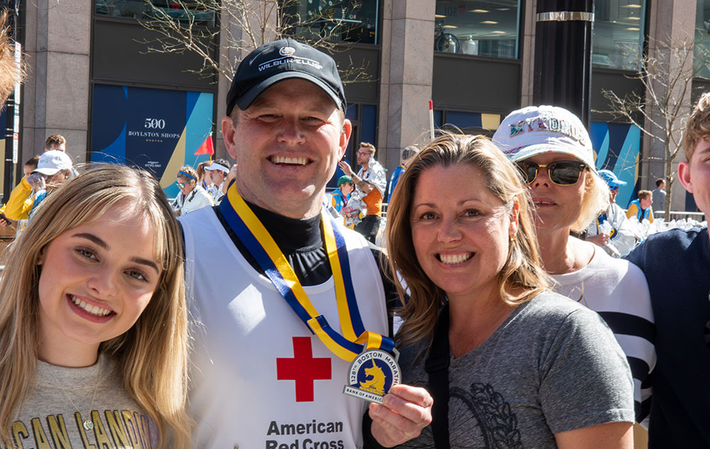 Marathon runner showing medal