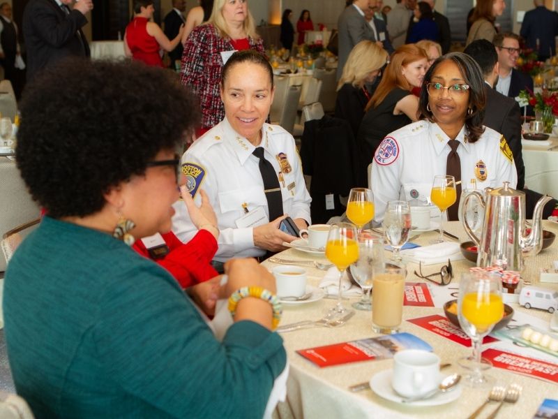 attendees sitting at table