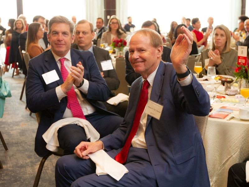 attendees sitting at table