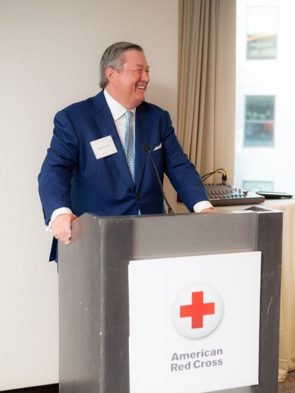 man standing at podium