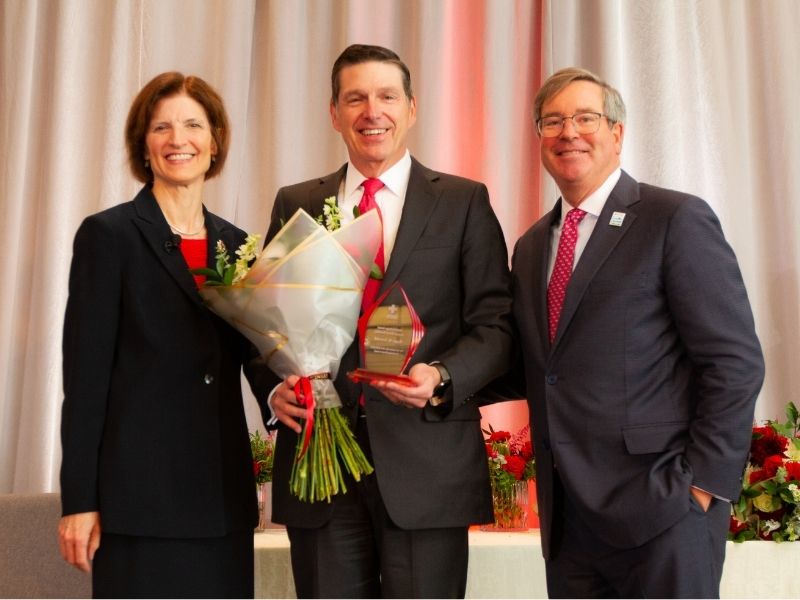 award reciepients holding flowers
