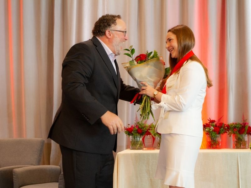 award reciepients holding flowers