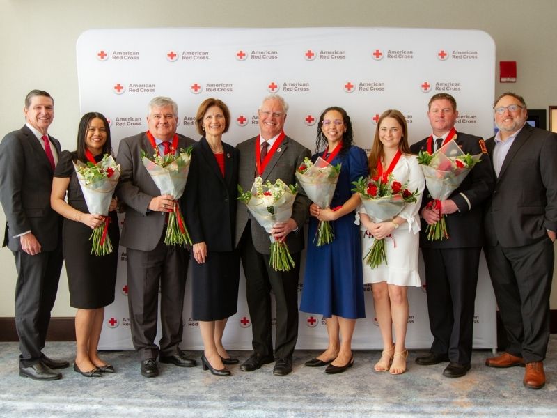 award reciepients holding flowers