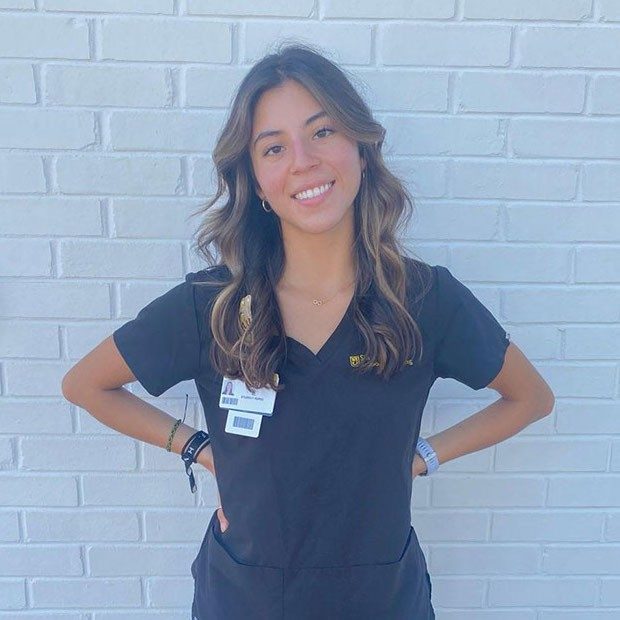 Sara Espindola in blue nurse scrubs