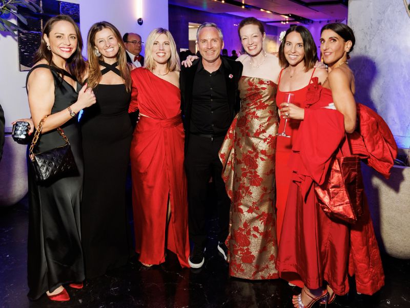 group of gala attendees posing for camera