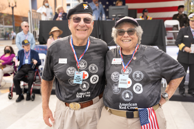 Two Red Cross volunteers posing and smiling for a picture.