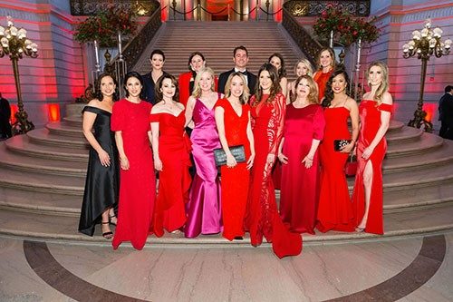 People in formal wear attend a Red Cross gala