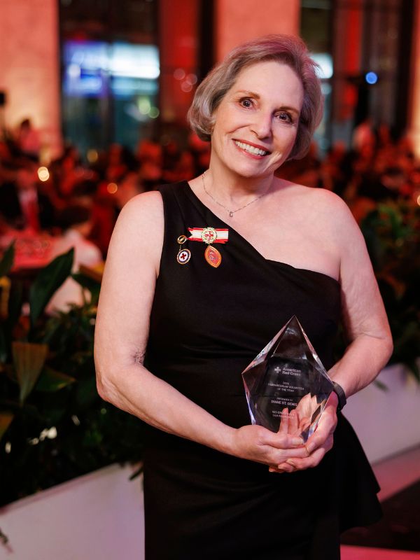 woman in red cross shirt