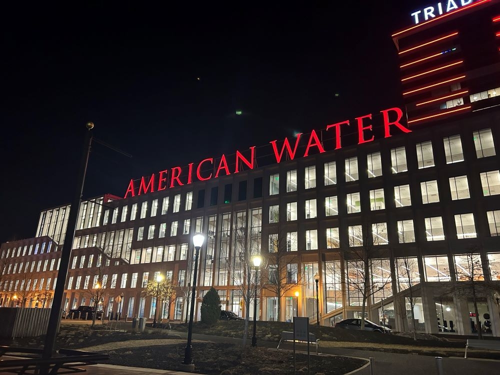 American Water building lit up Red
