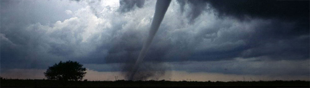 active tornado spinning with gray sky.