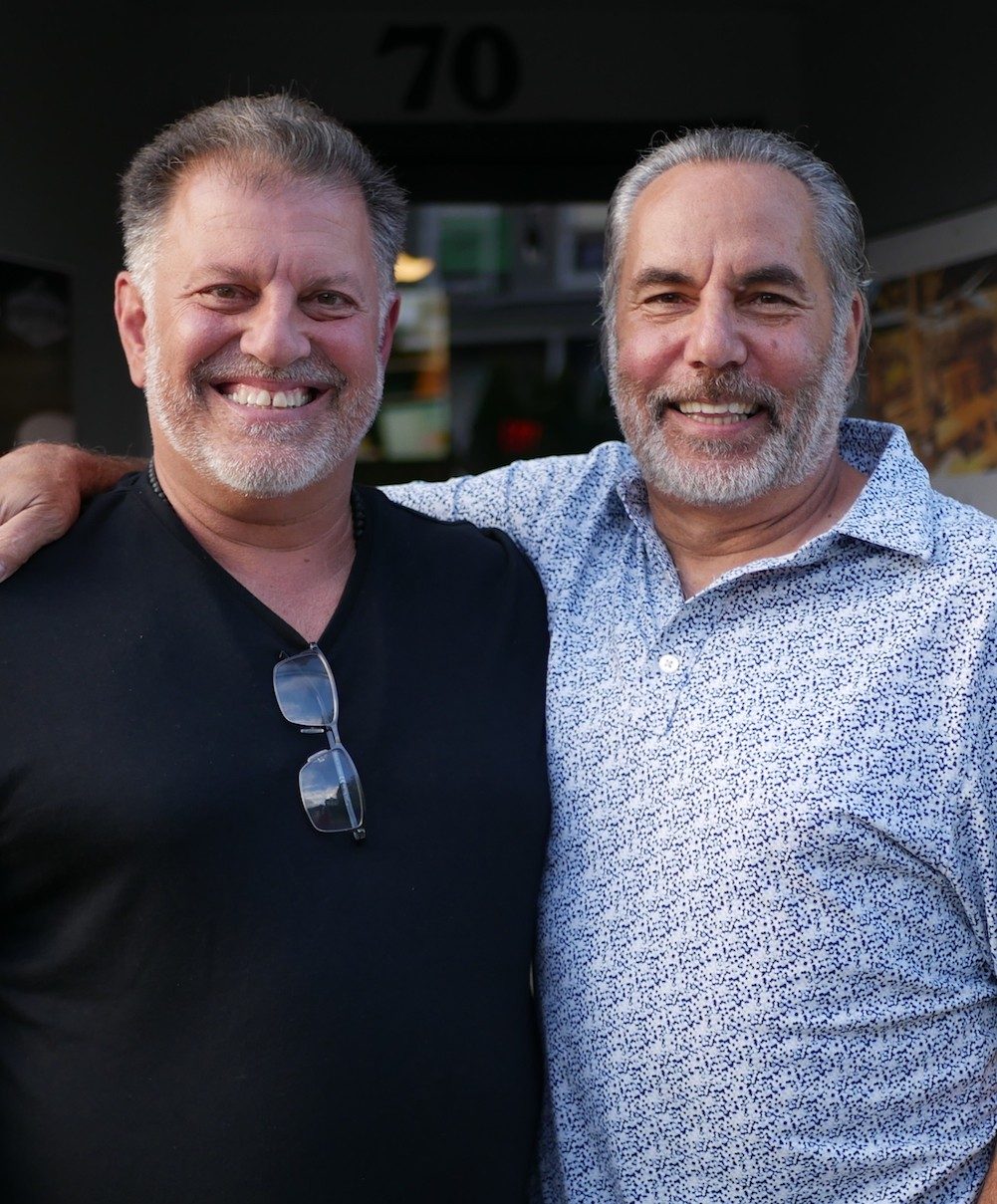 Anthony Lagos and Kevin J. Losee smiling at camera.