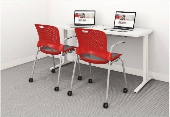 Casework Focus Room with chairs, table and laptops.